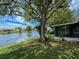 Home with a screened in porch and waterfront view at 3545 Landale Dr, Holiday, FL 34691