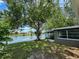 Waterfront home with lush greenery and water views at 3545 Landale Dr, Holiday, FL 34691