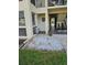 Exterior of the unit with rock landscaping, walkway, and covered entrance at 4743 Jasper Dr # 107, New Port Richey, FL 34652