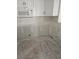 Bright kitchen features white cabinets and tile backsplash at 4743 Jasper Dr # 107, New Port Richey, FL 34652