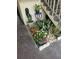 Landscaping features including colorful flowers and greenery at the condo entrance at 4743 Jasper Dr # 107, New Port Richey, FL 34652