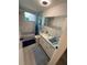 Modern bathroom with marble tile, updated fixtures, and a shower-tub combination at 5208 Chet Dr, New Port Richey, FL 34652