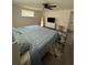 Spacious bedroom features a cozy bed, soft natural light and a ceiling fan at 5208 Chet Dr, New Port Richey, FL 34652