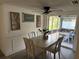 Sunlit dining area with sliding glass doors, stylish decor and comfortable seating at 5208 Chet Dr, New Port Richey, FL 34652