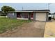 Charming single-story home with a well-maintained lawn and inviting front porch at 5208 Chet Dr, New Port Richey, FL 34652
