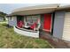 Inviting front porch with seating area and well-maintained landscaping at 5208 Chet Dr, New Port Richey, FL 34652