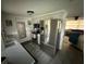 Bright kitchen featuring stainless steel appliances and an open layout to the living room at 5208 Chet Dr, New Port Richey, FL 34652