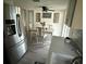 Well-lit dining area with modern refrigerator and a charming 'sweet home' wall decor at 5208 Chet Dr, New Port Richey, FL 34652