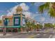 Charming downtown street view with vibrant storefronts, palm trees, and a classic small-town atmosphere at 5710 Broadway Ave, New Port Richey, FL 34652