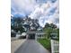 Charming single Gathering home featuring a driveway, carport, well-manicured lawn and picket fence at 5710 Broadway Ave, New Port Richey, FL 34652