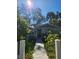 Charming single-Gathering home featuring a lush green lawn and a welcoming entrance with picket fence at 5710 Broadway Ave, New Port Richey, FL 34652