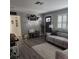 Cozy living room featuring neutral walls, decor, a comfortable gray couch and stylish flooring at 5710 Broadway Ave, New Port Richey, FL 34652