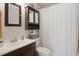 Bathroom with tub/shower combo, single sink vanity and tiled floor at 6347 Shadydale Ave, Spring Hill, FL 34609