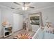 Bright Bedroom with a ceiling fan, natural light and room for storage at 6347 Shadydale Ave, Spring Hill, FL 34609