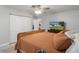 Bedroom with neutral colors, tile floors, ceiling fan and closet at 6347 Shadydale Ave, Spring Hill, FL 34609