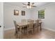 Bright dining room with large table, neutral paint and tile floors at 6347 Shadydale Ave, Spring Hill, FL 34609