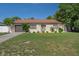 Charming single-story home featuring a well-manicured lawn, tidy landscaping, and an attached garage at 6347 Shadydale Ave, Spring Hill, FL 34609