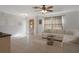 Bright living room featuring tiled floors, neutral paint, and a door at 6347 Shadydale Ave, Spring Hill, FL 34609