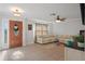 Bright living room with tiled floors, neutral paint, and comfortable seating arrangement at 6347 Shadydale Ave, Spring Hill, FL 34609