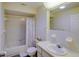 Well-lit bathroom with a shower over tub, toilet, and a vanity with a sink at 6462 River Run Blvd, Weeki Wachee, FL 34607
