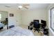 Bedroom with neutral tones, natural light, desk area, ceiling fan and a closet at 6462 River Run Blvd, Weeki Wachee, FL 34607