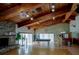 The community room is bright with natural light, a wood ceiling, stone fireplace, and direct access to outdoor activities at 6462 River Run Blvd, Weeki Wachee, FL 34607