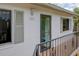 Inviting condo entrance featuring a secure door and updated exterior lighting at 6462 River Run Blvd, Weeki Wachee, FL 34607