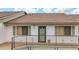 Charming condo exterior with a secure fenced porch area on a sunny day at 6462 River Run Blvd, Weeki Wachee, FL 34607
