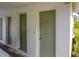 Exterior of the condo with neutral paint color and multiple doors at 6462 River Run Blvd, Weeki Wachee, FL 34607
