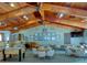 Community game room boasts a vaulted wood ceiling, foosball table, and multiple seating areas for relaxing with friends at 6462 River Run Blvd, Weeki Wachee, FL 34607