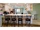 Bright and open kitchen with island seating and stainless steel appliances, with modern pendant lighting at 6462 River Run Blvd, Weeki Wachee, FL 34607