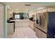Bright open kitchen with stainless steel appliances, and white cabinetry, ideal for entertaining at 6462 River Run Blvd, Weeki Wachee, FL 34607