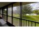 Relax in this screened lanai overlooking the community pool and lush greenery, perfect for outdoor living at 6462 River Run Blvd, Weeki Wachee, FL 34607