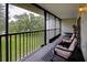Enjoy this covered lanai with seating and views of the manicured lawn, providing a tranquil outdoor space at 6462 River Run Blvd, Weeki Wachee, FL 34607