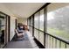 Relaxing screened lanai with neutral furnishings, offering scenic outdoor views and natural light at 6462 River Run Blvd, Weeki Wachee, FL 34607