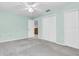 Spacious bedroom with a ceiling fan, and three closets for plenty of storage at 7230 Hummingbird Ln, New Port Richey, FL 34655