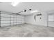 Spacious two car garage with a roll up garage door at 7230 Hummingbird Ln, New Port Richey, FL 34655