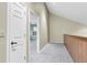 Light and bright hallway with neutral carpet and freshly painted walls, and natural light at 7230 Hummingbird Ln, New Port Richey, FL 34655