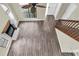 High-angle view of a spacious living room with wood floors, fireplace, and staircase at 7230 Hummingbird Ln, New Port Richey, FL 34655