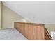 Loft space showcasing high ceilings and a railing at 7230 Hummingbird Ln, New Port Richey, FL 34655