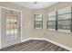 Room featuring a door to the outside, lots of light, and neutral paint at 7230 Hummingbird Ln, New Port Richey, FL 34655