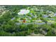 Aerial view showcases community with lush greenery and winding creek at 7700 Danube Dr # 7700, Hudson, FL 34667