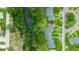 Aerial view of a neighborhood with mature trees and green lawns at 7700 Danube Dr # 7700, Hudson, FL 34667