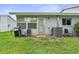 Backyard patio area with grill, perfect for outdoor entertaining and relaxation at 7700 Danube Dr # 7700, Hudson, FL 34667