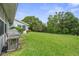 Spacious backyard featuring a grill and plenty of room for outdoor activities at 7700 Danube Dr # 7700, Hudson, FL 34667