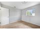 Bedroom featuring carpet, white walls, ceiling light, and closet with a door at 7700 Danube Dr # 7700, Hudson, FL 34667