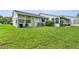 Backyard view featuring a well maintained lawn perfect for entertaining at 7700 Danube Dr # 7700, Hudson, FL 34667