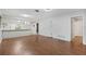 Spacious living room with modern flooring and convenient access to the kitchen area at 7700 Danube Dr # 7700, Hudson, FL 34667
