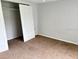 A bedroom with a closet and a door, offering ample space at 7714 Fox Hollow Dr, Port Richey, FL 34668