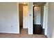 A bedroom with a closet and doorways leading to other areas of the house at 7714 Fox Hollow Dr, Port Richey, FL 34668